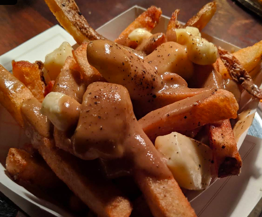 Cafe du Pays signature dishes Poutine
Tourtière (Meat Pie)
Duck in a Can